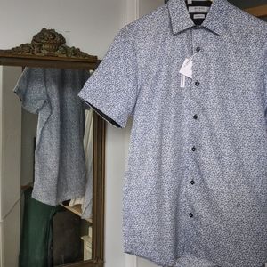 Button-down floral pattern short sleeved shirt.